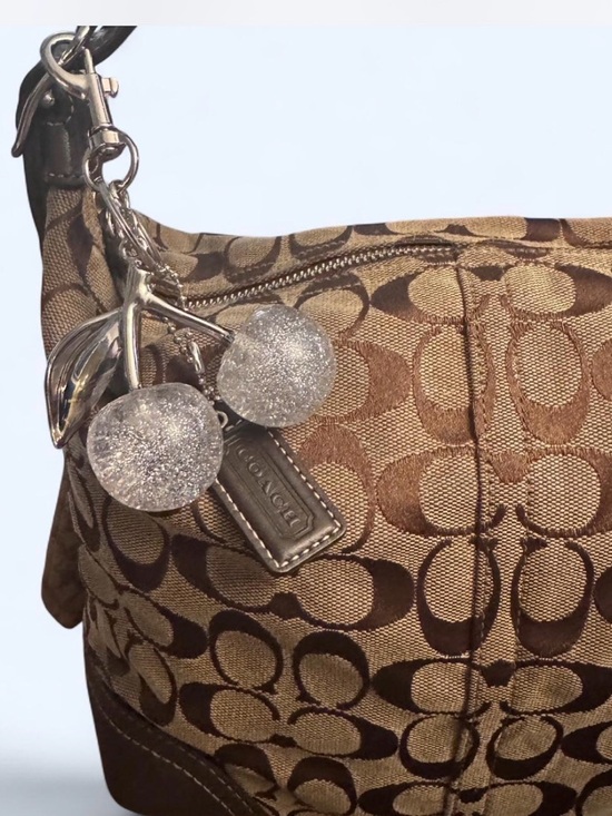 Coach Handbags - Coach Brown Logo Jacquard Shoulder Bag with Sparkle Cherry Charm